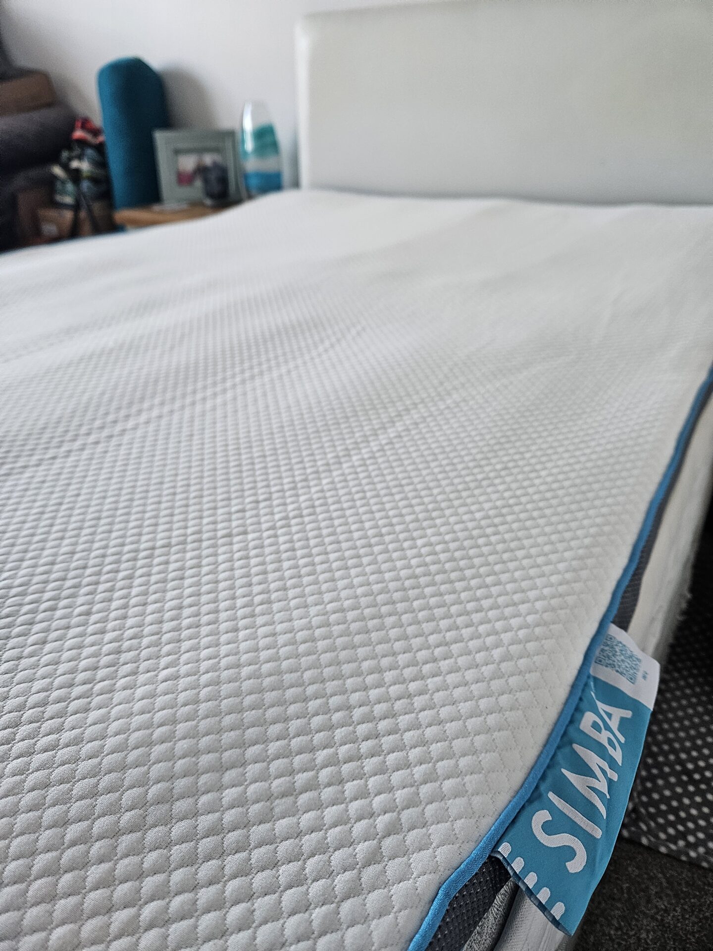 White mattress hybrid topper with a blue SIMBA label 