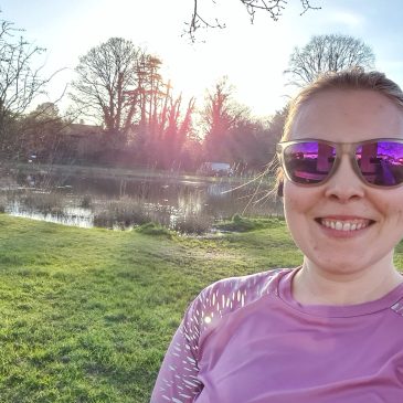 Running selfie in front of pond